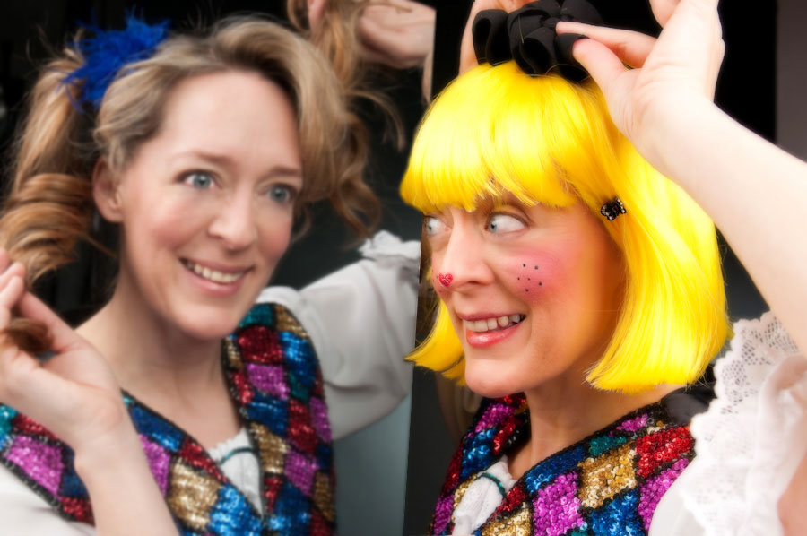 Two women in costumes posing for a picture.